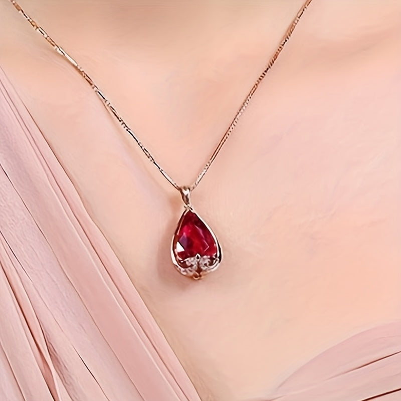 Elegant water drop-shaped pendant necklace coated in rose gold with simulated pigeon blood red and sapphire stones, exuding European and American flair for fashion-forward women.