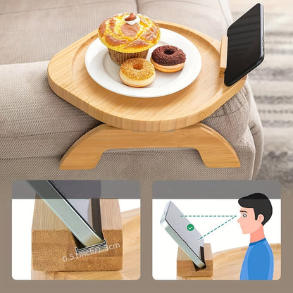 Non-slip sofa tray with phone holder and foldable armrest table, ideal for wide sofas and includes a drink holder shelf. Made of wood.