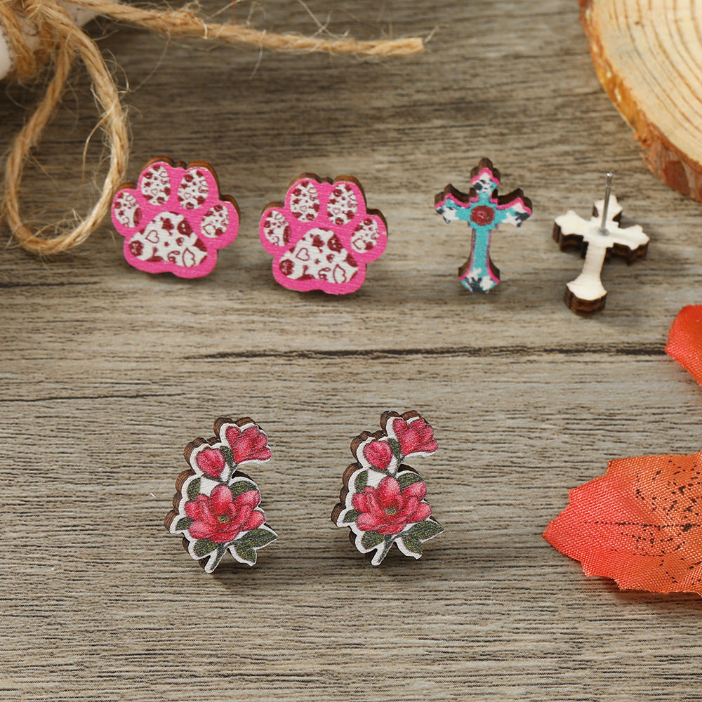 Get 9 pairs of women's fashion earrings for Valentine's Day, including pink rose love earrings, wooden cupid's arrow calendar earrings, coffee cup love earrings, palm bier earrings, and more. These earrings are made from wooden materials and will make