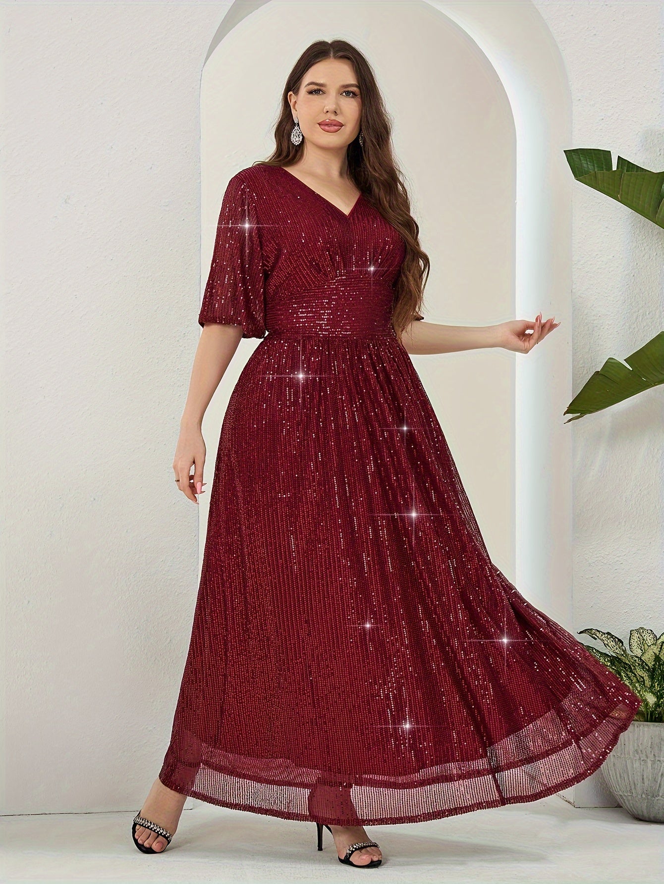 Elegant plus-size sequin maxi dress with v-neck and half sleeves. Made of non-sheer polyester with zip detail. Suitable for all seasons.