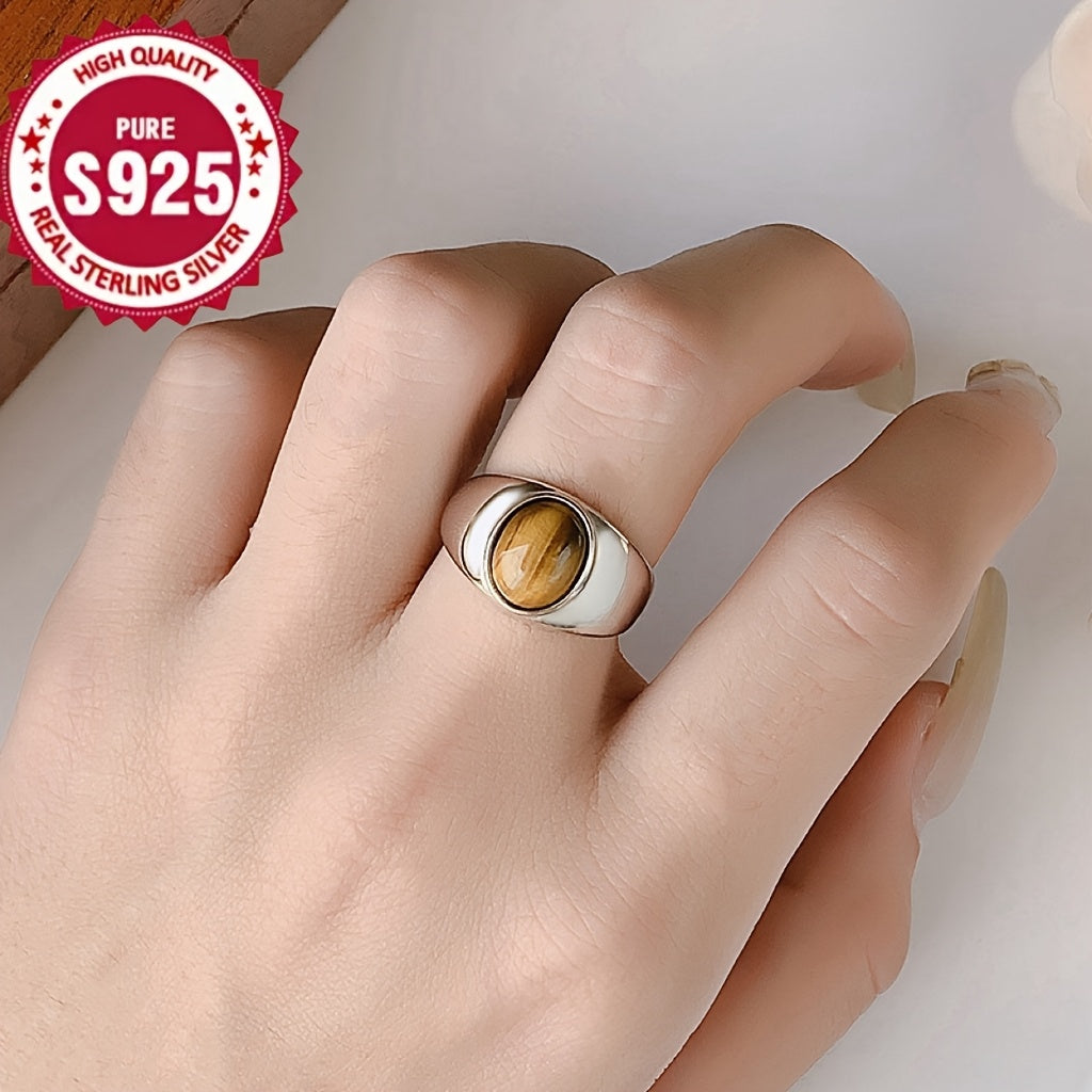 A versatile S925 silver ring adorned with a natural Tiger's Eye stone, offering impeccable quality and intricate design. Perfect for both men and women, showcasing a stunning appearance that is ideal for gifting or wearing on any occasion, whether it be