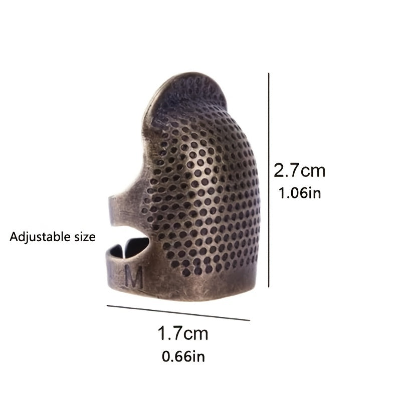 Vintage metal thimble for needlework and crafting.