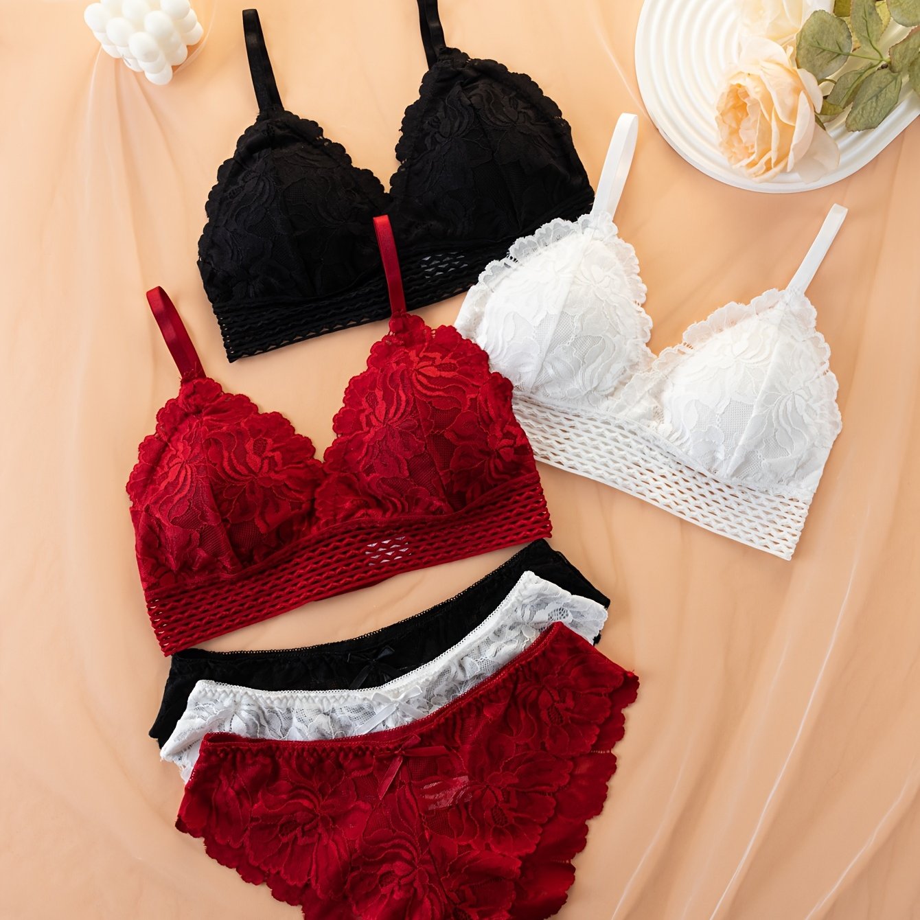 Elegant lace bra and panty set, comfortable wireless design with spaghetti straps and bow decorations. Women's lingerie and underwear set of 3 pieces.