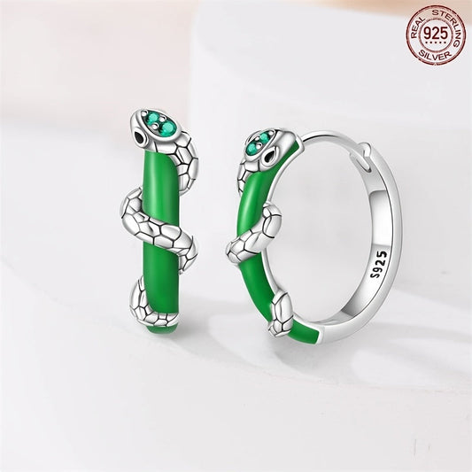 Vintage luxury meets elegance in these stunning pair of 925 sterling silver hoop earrings. Featuring a green spiral snake design adorned with synthetic zirconia, these earrings are perfect for those born in December. The animal theme adds a unique touch