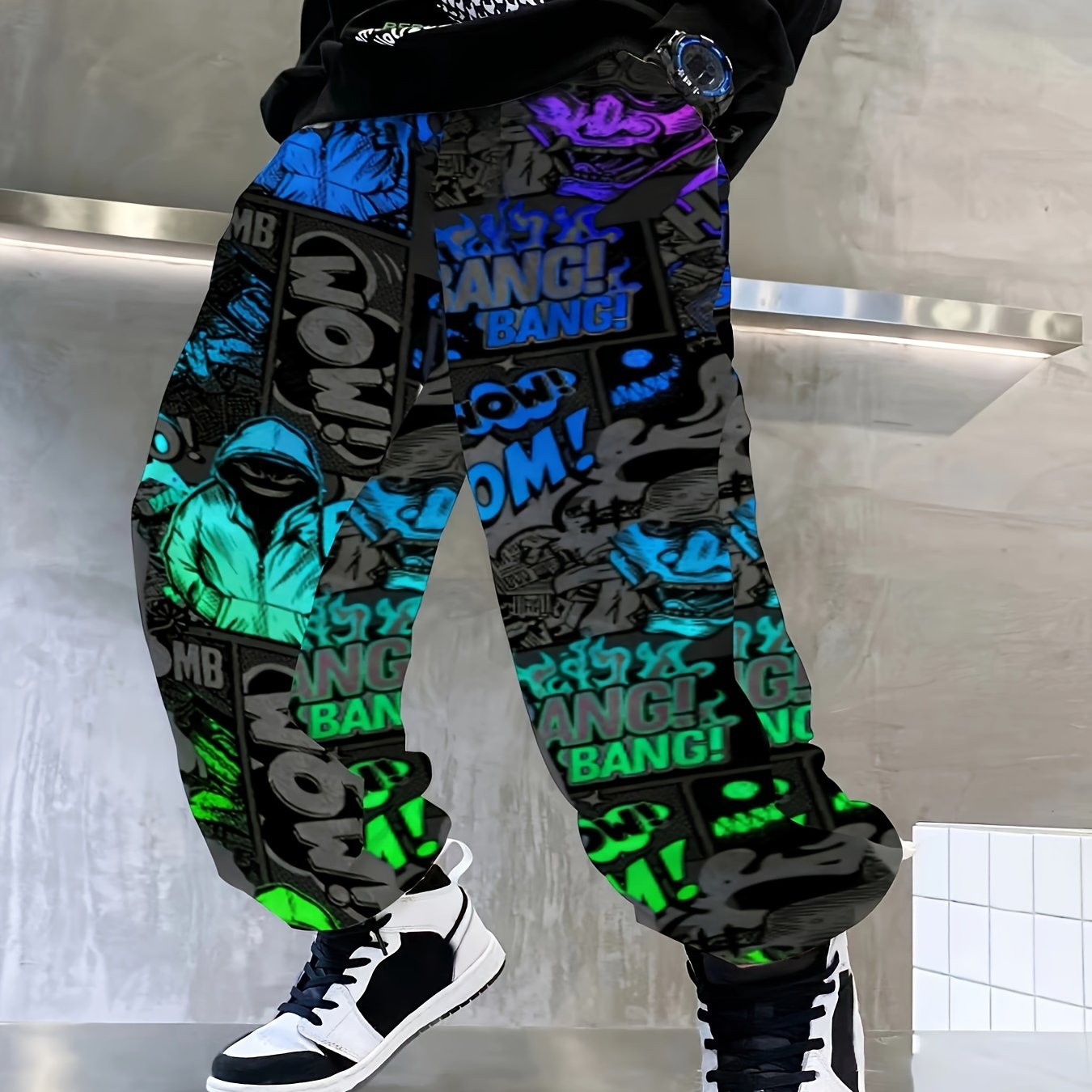 Comfy boys joggers with graffiti and ink splashes, elastic waist.