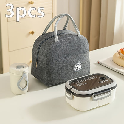 Three-piece set of versatile lunch bags with inner compartments and storage pouches, perfect for school, work, picnics and camping.