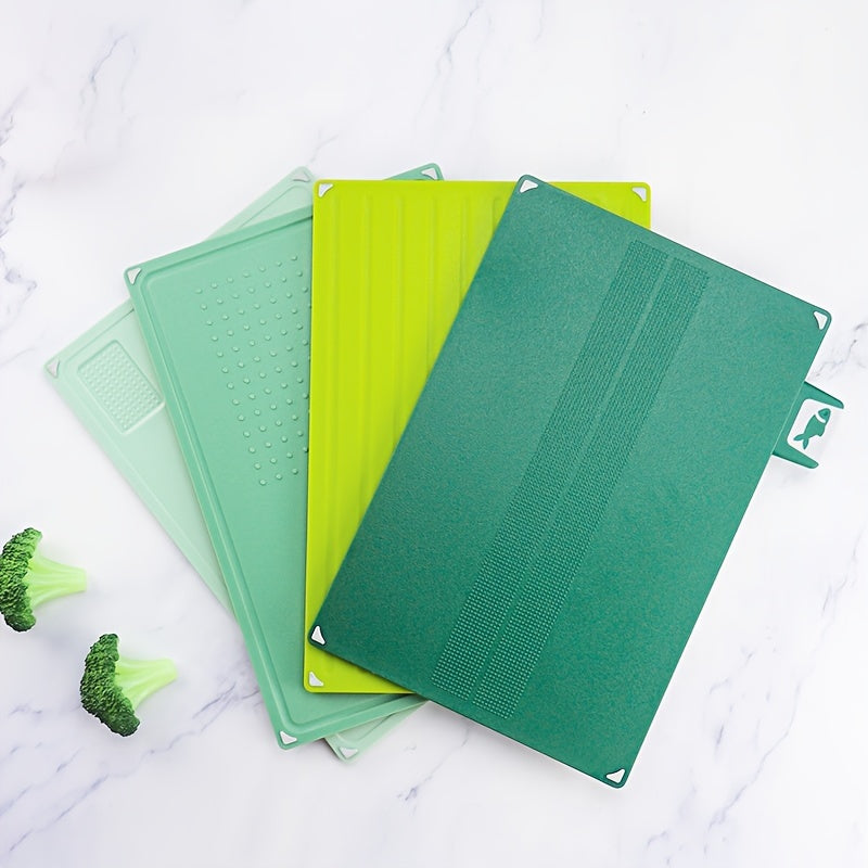 A set of four square cutting boards with a non-slip base, made of thickened plastic and accompanied by a storage rack. These cutting boards are designed for easy fruit and vegetable preparation, with a spill-proof classification system. Perfect for