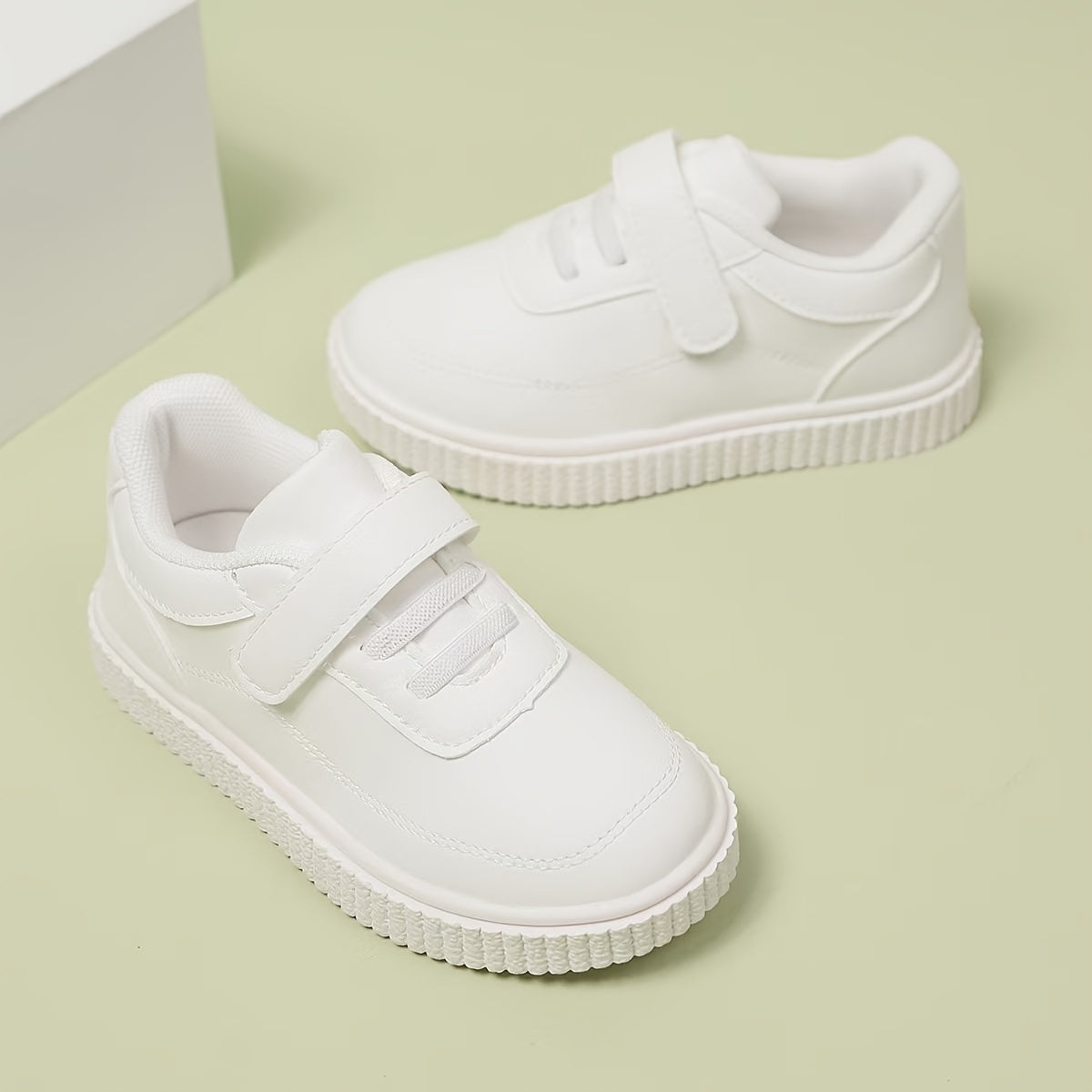 Kids White Sneakers - Lightweight sports shoes with Bullock detail, stylish and versatile for boys and girls under 14.