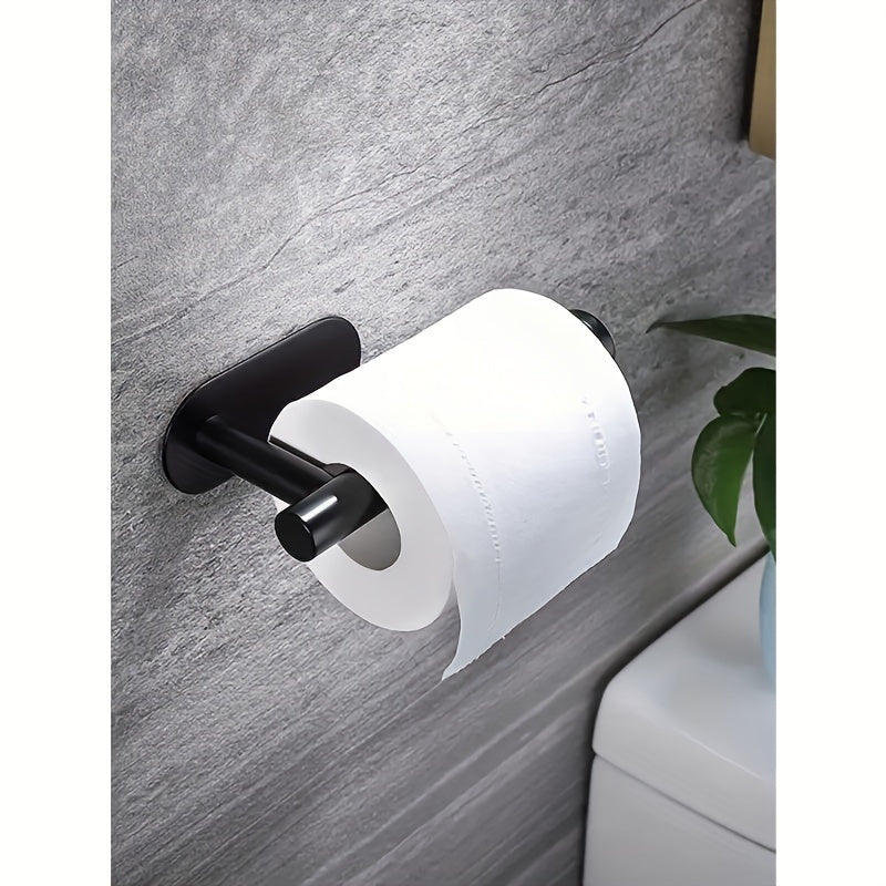 Stainless steel self-adhesive toilet paper holder.