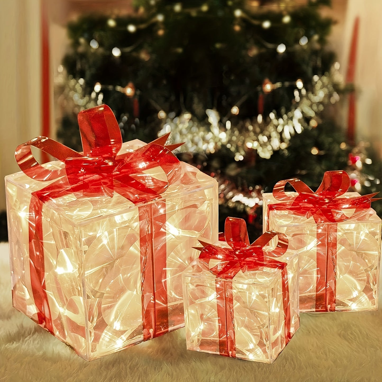 Set of 3 Christmas lighted gift boxes with warm white transparent lights and red bows for outdoor Christmas decorations.