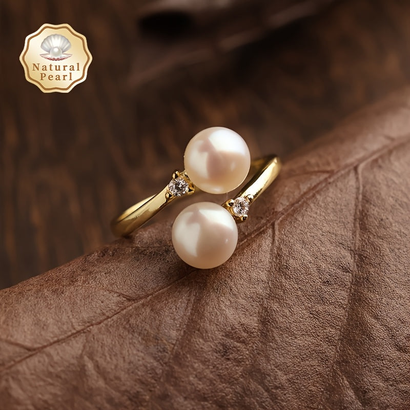 This elegant and unique pearl ring is the perfect accessory for women. It features two 6-7mm natural freshwater pearls on an open ring design, making it a fashionable and personalized piece. Ideal for weddings or as a special gift, this ring comes