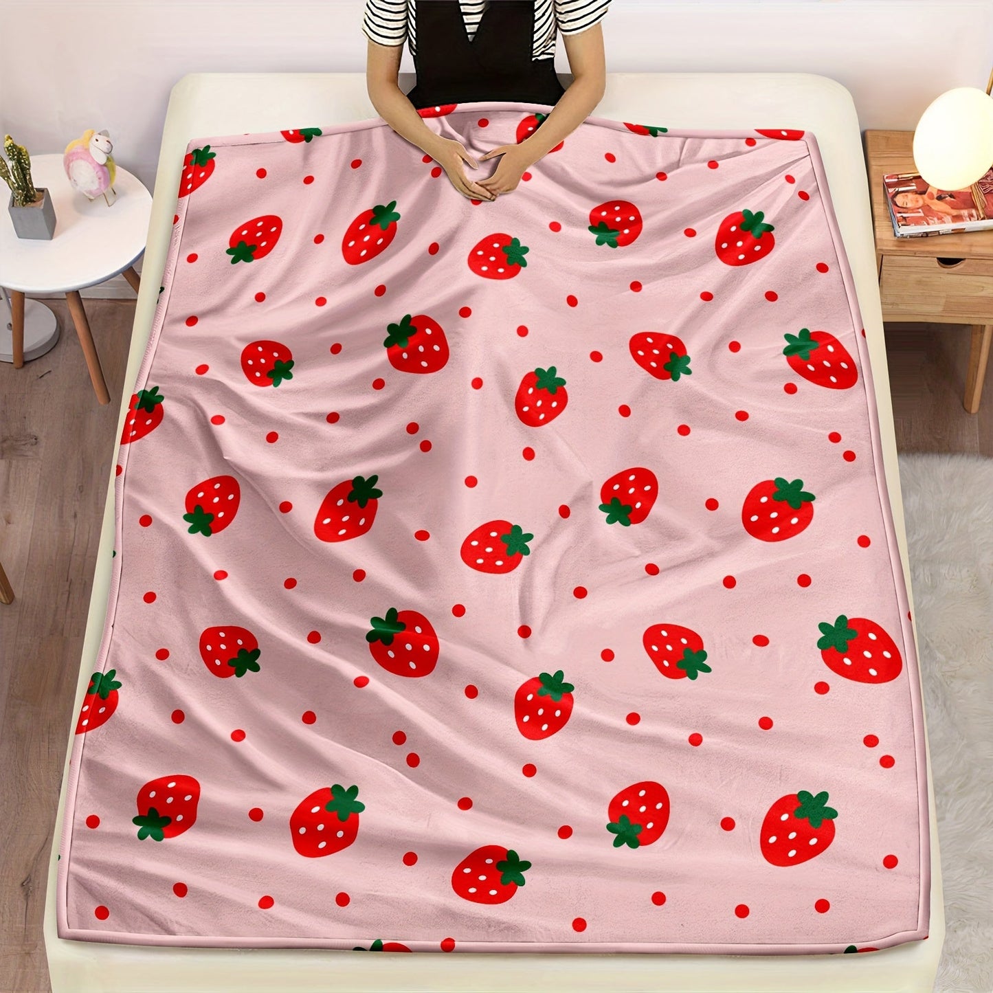 One piece of a strawberry printed throw blanket, perfect for bed, sofa, office, camping, or traveling. This soft and cozy blanket is versatile and makes a great gift for all seasons.