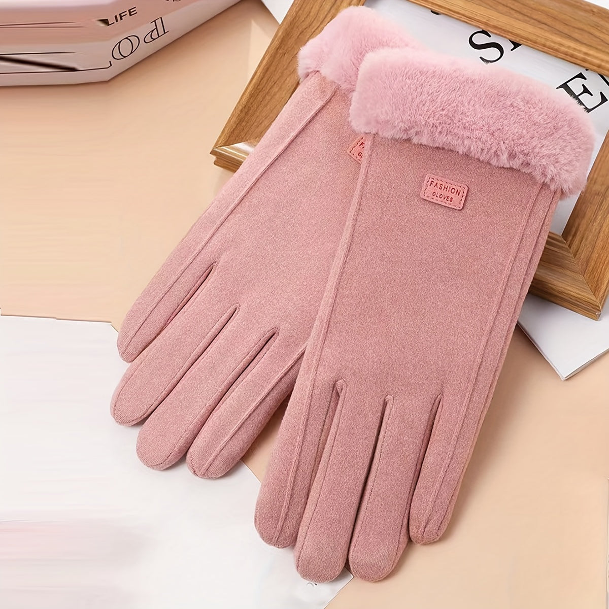 Warm and comfy beige touchscreen gloves for women with a plush lining to keep hands cozy in the winter featuring a full finger design.