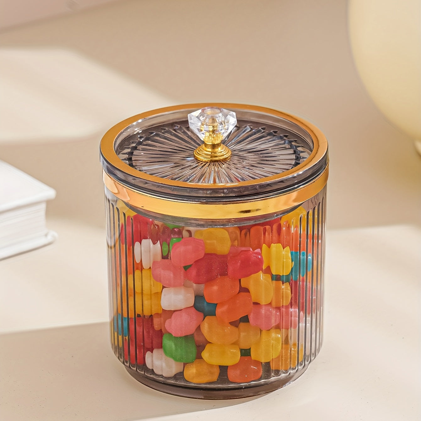 One piece of a transparent amber sketch golden grey bead decorated jar with a lid for candies. Made of plastic, can only be hand washed. It is a reusable sealed fresh-keeping box for storing cereal, rice, pasta, tea, nuts, and coffee beans. Perfect for