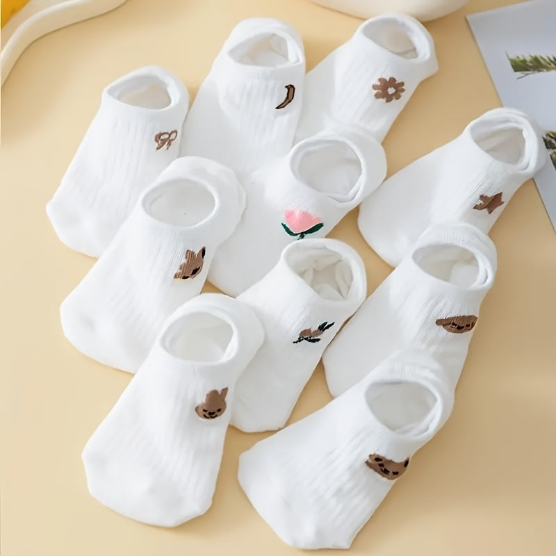 10 pairs of adorable white ankle socks with embroidered patterns, perfect for everyday wear.