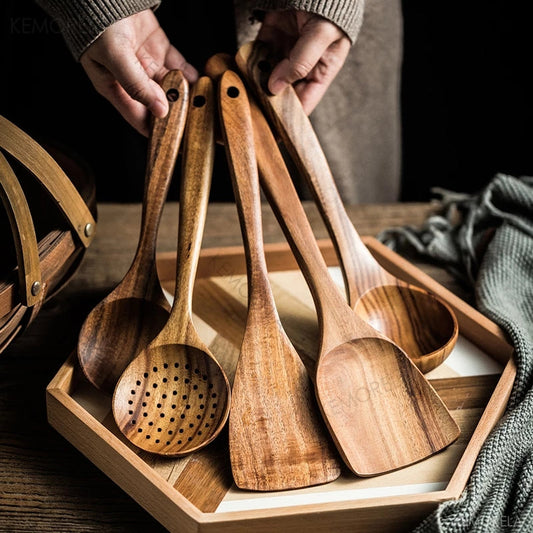 Set of 4/7 pieces of kitchen tools made from natural teak wood from Thailand, including spoons, ladles, turners, colanders, skimmers, and scoops, suitable for cooking and serving in the kitchen.