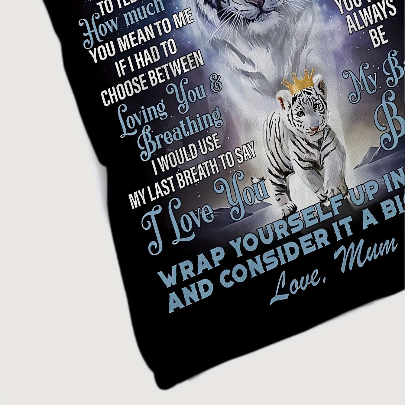 A cozy white tiger pattern flannel blanket perfect for your son, with a heartfelt message from Mom. This blanket provides all-season comfort, is hypoallergenic, hand washable, and versatile for various uses. Weighs between 200-250g.