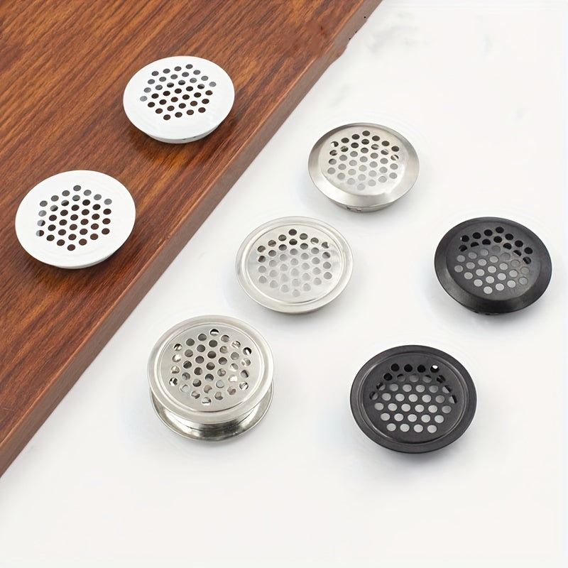 A set of 5 stainless steel circular shoe cabinet vents with flat breathable holes, designed for ventilation and heat dissipation. These golden home accessories also include covers for the ventilation holes.