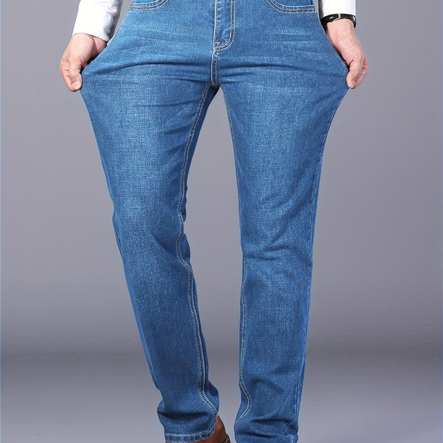 Men's casual cotton blend jeans with pockets, ideal for outdoor activities.