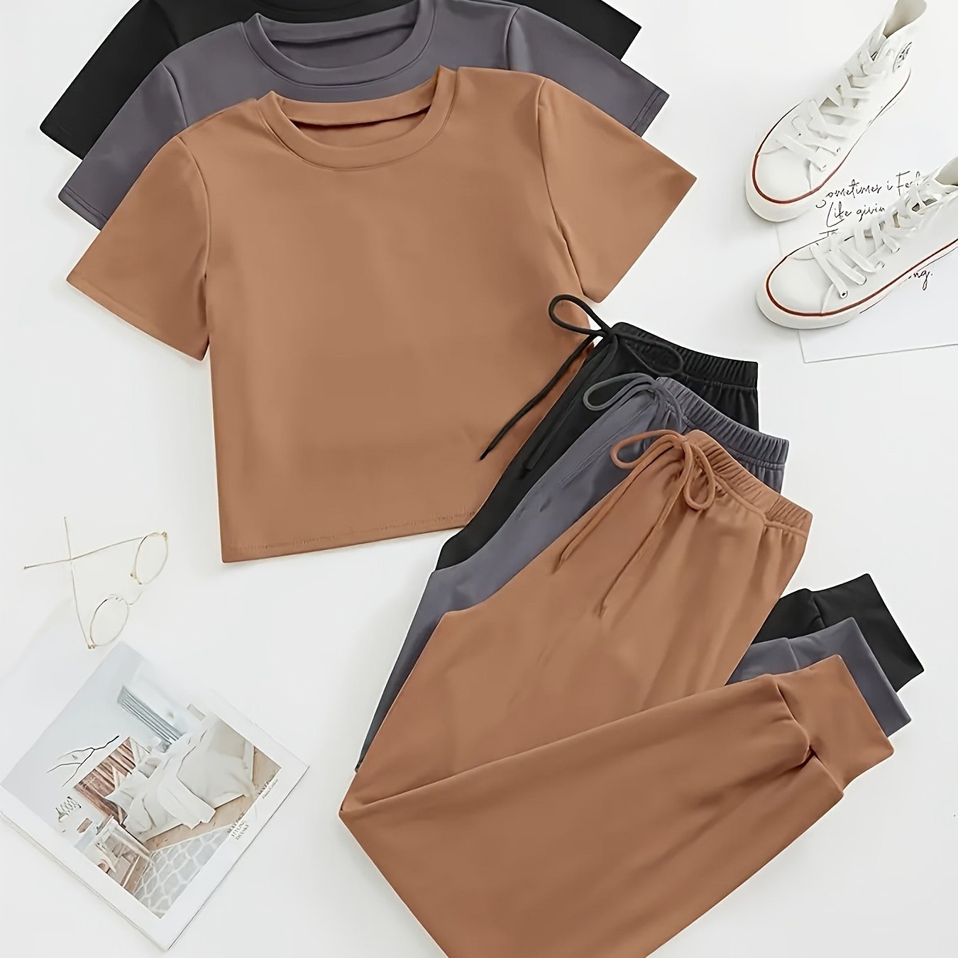 3 sets of women's solid color lounge sets with comfortable tee and tie front pants. Available in multiple colors for relaxed casual wear.