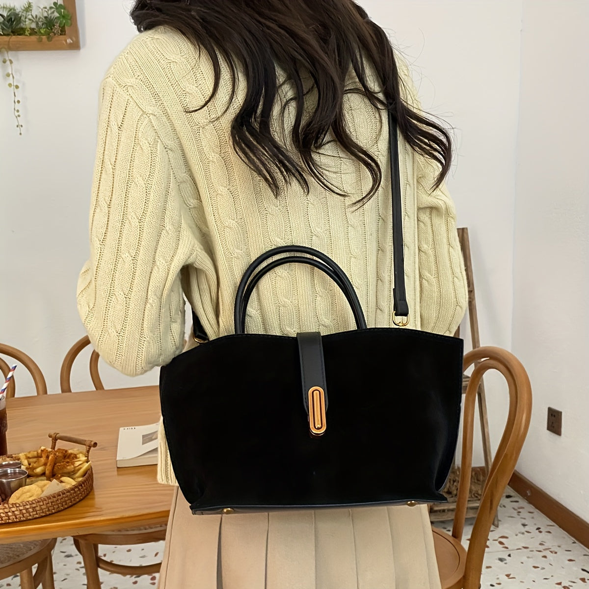 Adjustable shoulder strap tote bag with vintage style and retro large capacity, made from suede leather. Features turn lock closure and unlined fabric material.