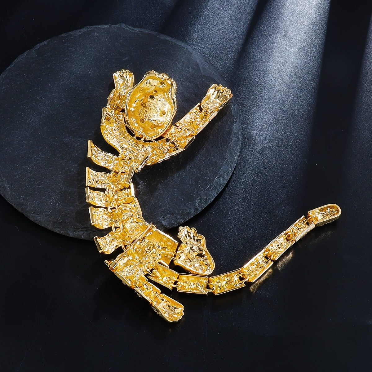 A premium rhinestone-studded tiger shoulder brooch.