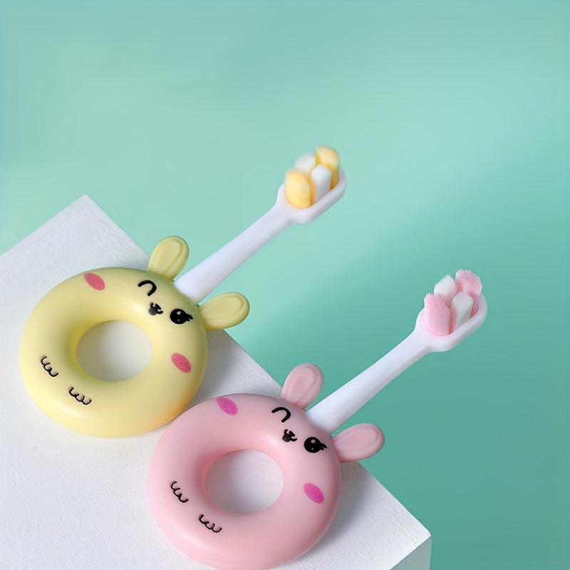 Gentle silicone baby toothbrush for toddlers aged 0-3. Features cute cartoon design and super soft bristles for gentle cleaning on sensitive teeth.