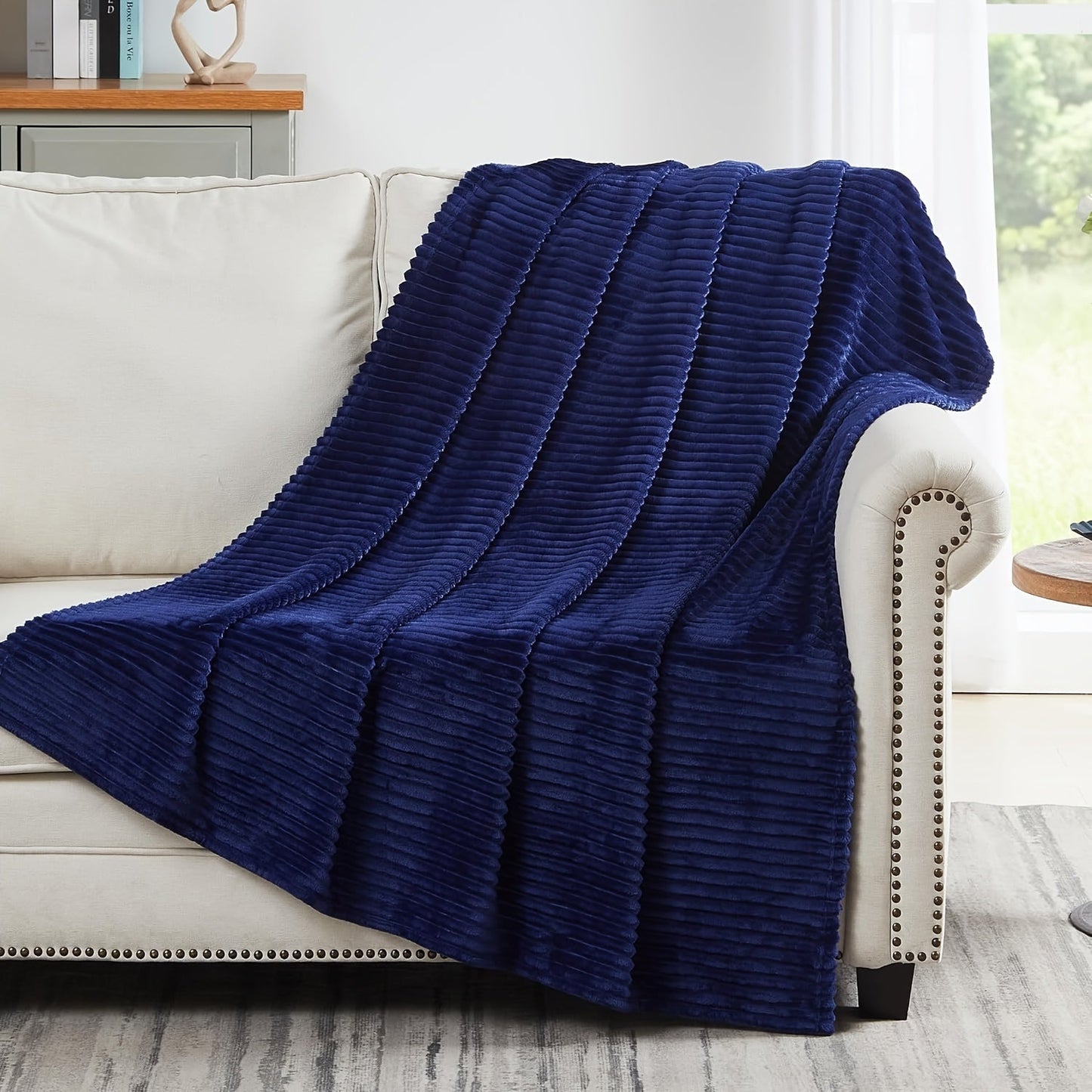 Stay cozy and warm with our Ultra-Soft Oversized Fleece Throw Blanket. Made with lightweight and warm 280GSM microfiber, this blanket features a 3D ribbed Jacquard design for added style. Hypoallergenic and perfect for all seasons, this blanket is a