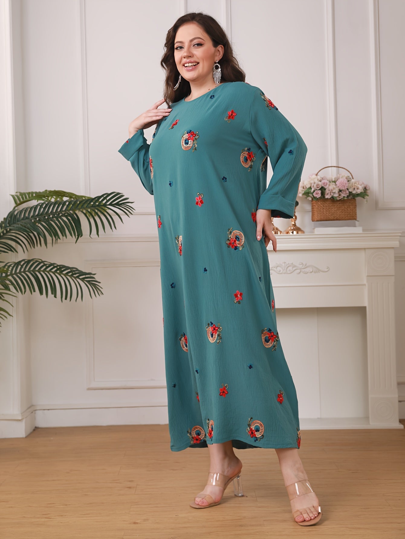 Elegant floral print women's plus size abaya with long sleeves and loose fit in traditional Middle Eastern style.