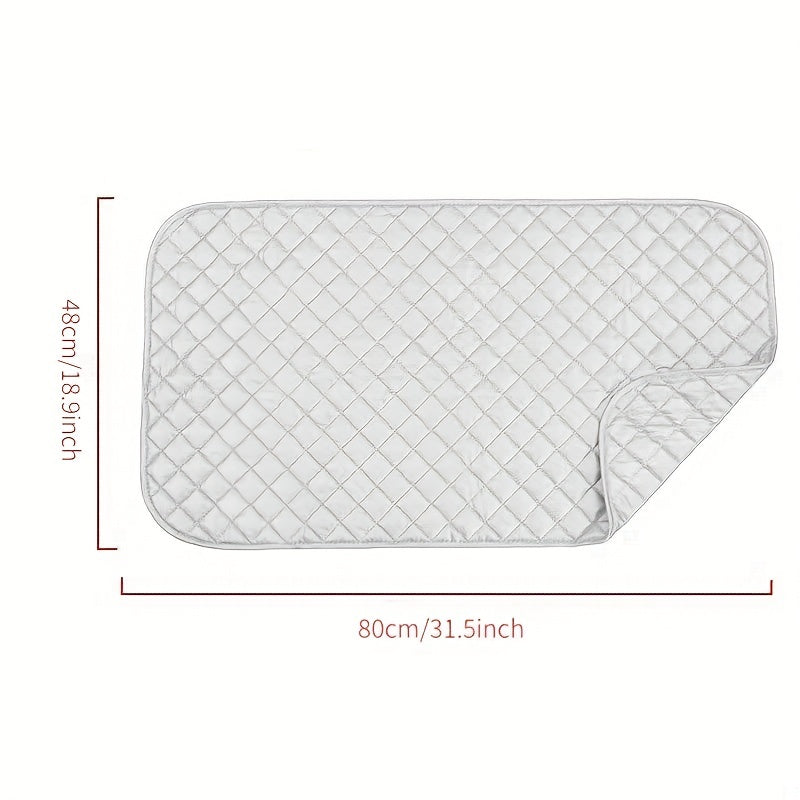 Portable ironing board with garment steaming capabilities, featuring heat insulation and high temperature resistance. This foldable mat is double-sided with a silvery, diamond lattice design for added style.