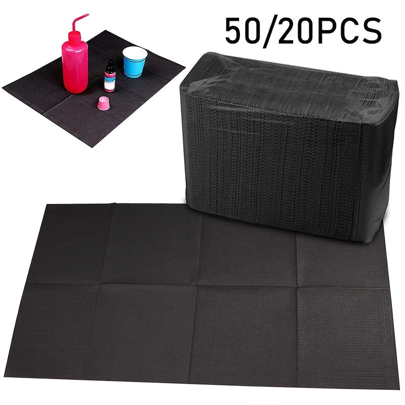 Pack of 50 black disposable cleaning pads for tattoo and nail art painting. These waterproof and durable pads are ideal for household cleaning and removing stains.