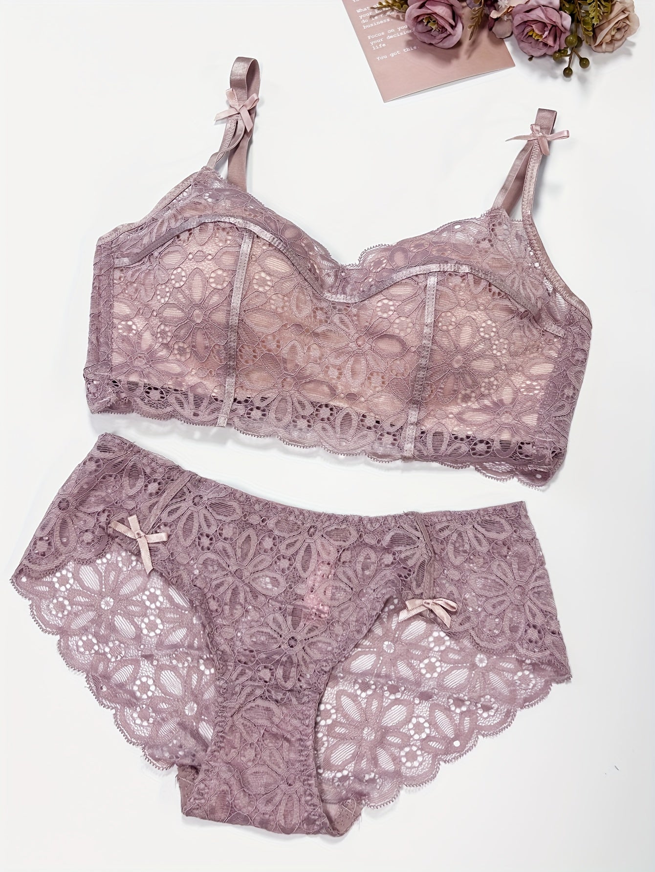 Sexy lace lingerie set for women, with medium support bra and drop waist briefs. Made of polyamide and elastane blend with knit fabric weave. Features solid color with contrast lace details