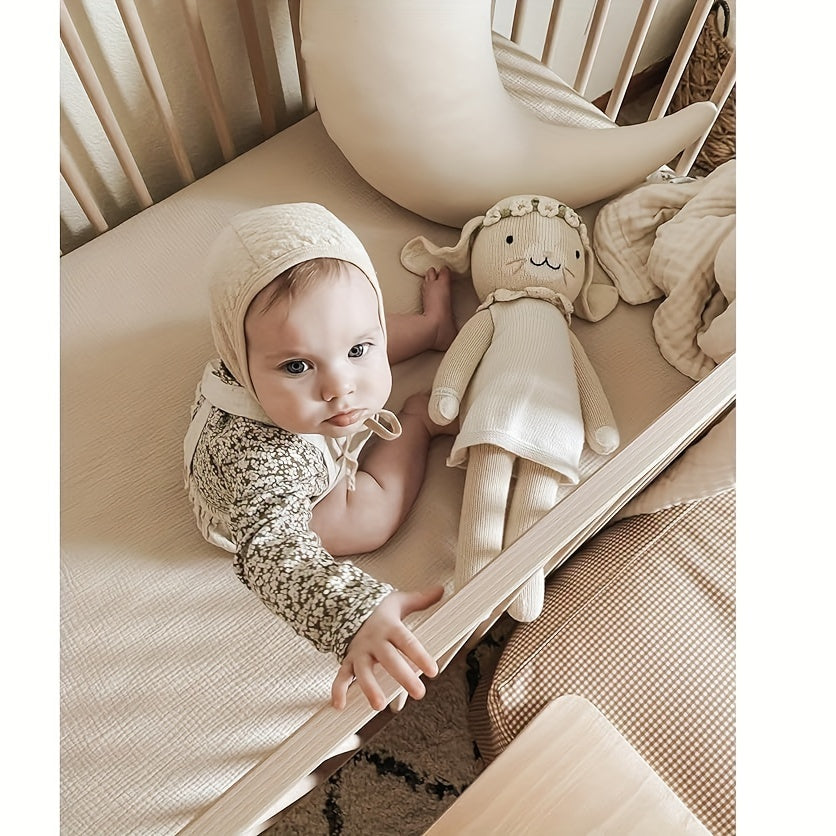 Muslin Fitted Crib Sheet made from 100% Cotton, Offers Softness and Breathability. Ideal for Standard Mattresses (71.12x132.08 cm). Comes in Ivory, Peach, Pink, Green, and Blue options.