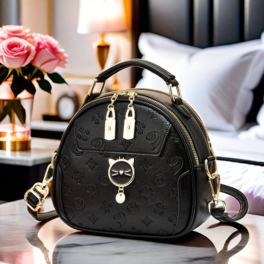 Trendy black round crossbody bag with adjustable strap, golden-tone hardware, "LOVE" design, zipper closure. Ideal for casual outings and commuting.