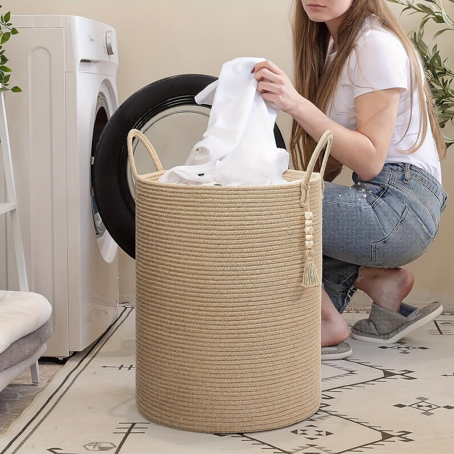 This tall laundry basket measures 40.64cm X 50.8cm and features a woven design with a convenient handle. It can be used as a blanket organizer in the living room, a storage basket for dog toys, or a decorative jute laundry hamper for clothes, pillows