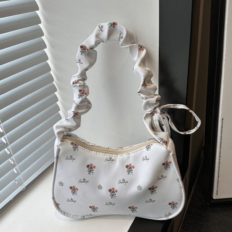 Stylish white and pink floral crossbody bag for women, suitable for daily use, travel, or as a gift.