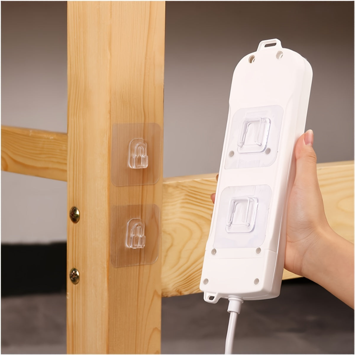 20 pack of wall mount power strip holders with clear interlocking buckles, plastic adhesive pads, and drill-free seamless fasteners for organizing bathroom and doors.