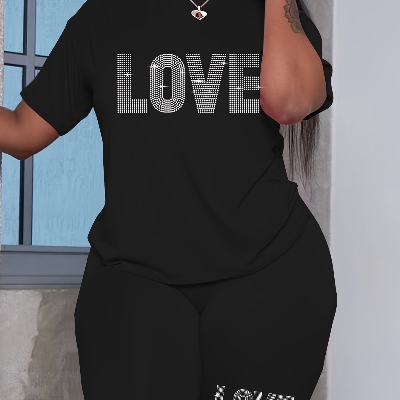 Plus-size women's casual polyester T-shirt and shorts set with alphabet love print, ideal for daily wear.