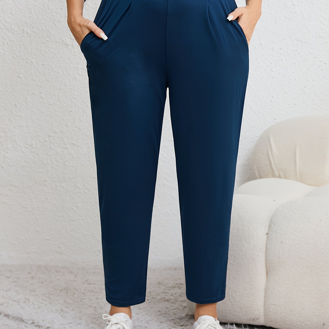 Plus size women's harem pants with high elasticity, ruched waist, pockets, and versatile for all seasons.