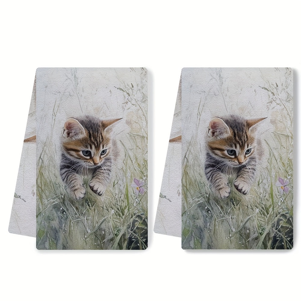 Two ultra soft kitchen towels featuring an adorable kitten in grass design. These towels are highly absorbent, machine washable, and perfect for adding a contemporary coastal touch to your kitchen decor. Each towel measures 40.64x60.96 cm. Perfect for