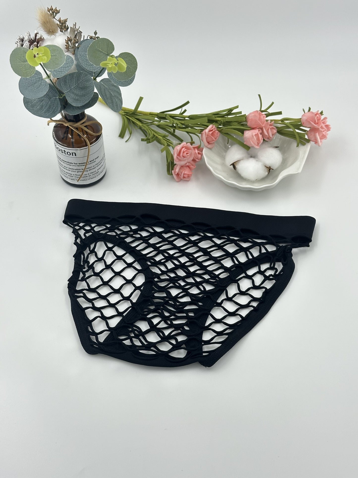 Women's sexy mesh panties made of nylon knit, with a seductive triangle brief design and seamless, breathable fabric.