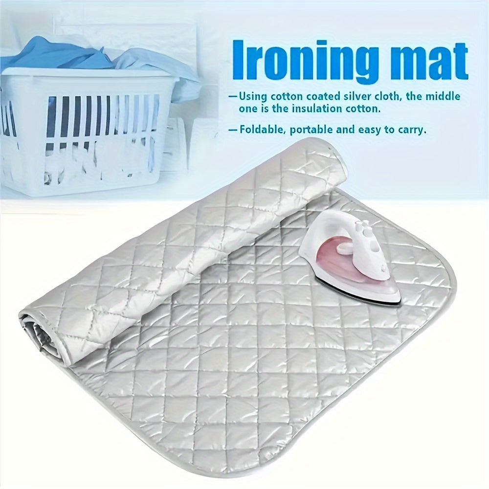 A portable ironing pad with a silver-plated exterior and a thick cotton interior. This heat-resistant, non-electric countertop pad is perfect for travel, hotel stays, or dorm rooms. It can also be used as a multifunctional laundry mat for dryers, washing