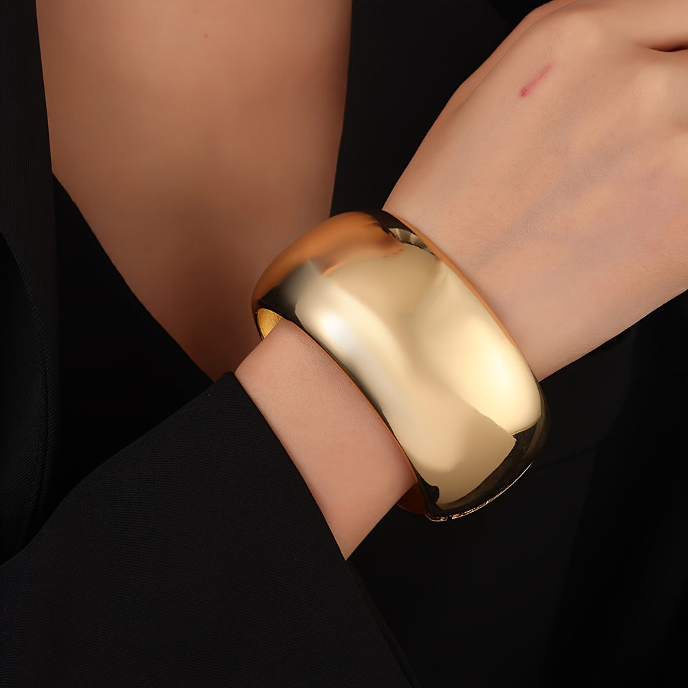 An elegant and sleek stainless steel drum bracelet with a wide and thick bangle design. This versatile fashion accessory is perfect for daily wear or gifting.