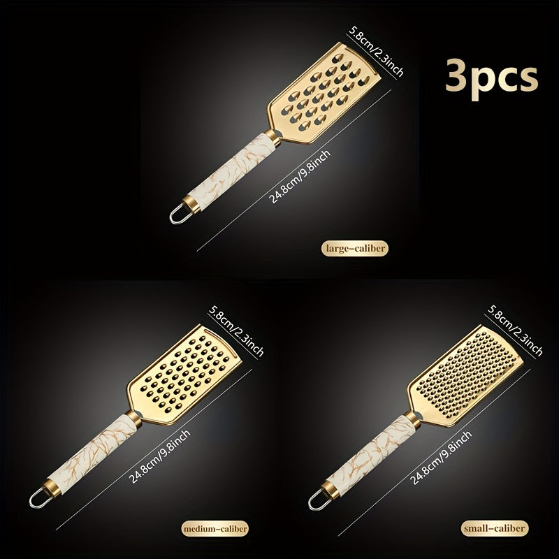 Stainless steel kitchen grater for shredding various foods, with a safe handle and luxurious golden appearance.