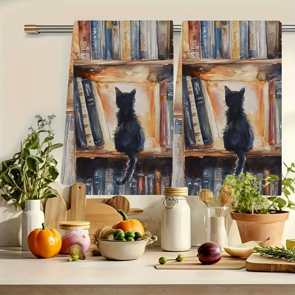 Two pieces of ultra soft kitchen towels featuring a charming library kitten design. These highly absorbent and machine washable dish hand towels measure a cozy 40.64x60.96 cm, making them perfect for home decor and practical for kitchen use.