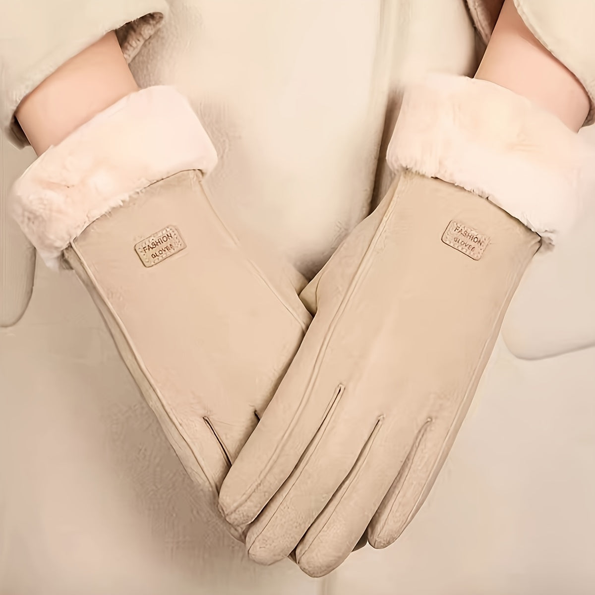 Warm and comfy beige touchscreen gloves for women with a plush lining to keep hands cozy in the winter featuring a full finger design.