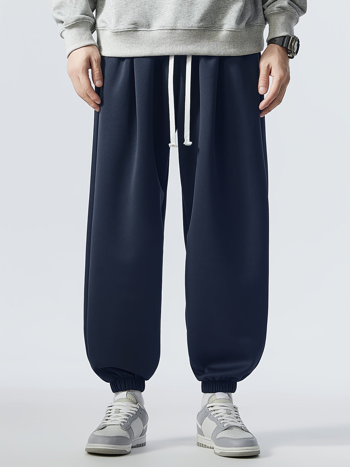 Loose fit, striped sweatpants for men, plus size, made of polyester blend with elastic waistband and drawstring. Machine washable for year-round comfort.