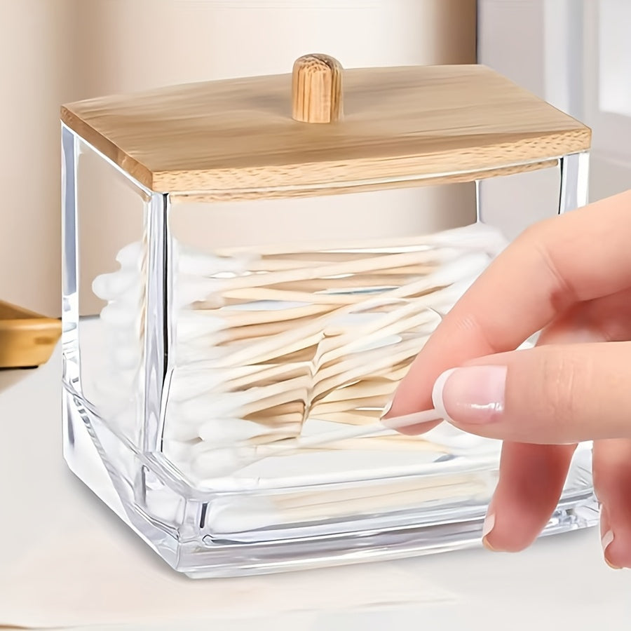 3 transparent storage jars with bamboo lids for organizing swabs, pads, and floss. Includes wooden dispenser box. Ideal for bathroom and home office organization.