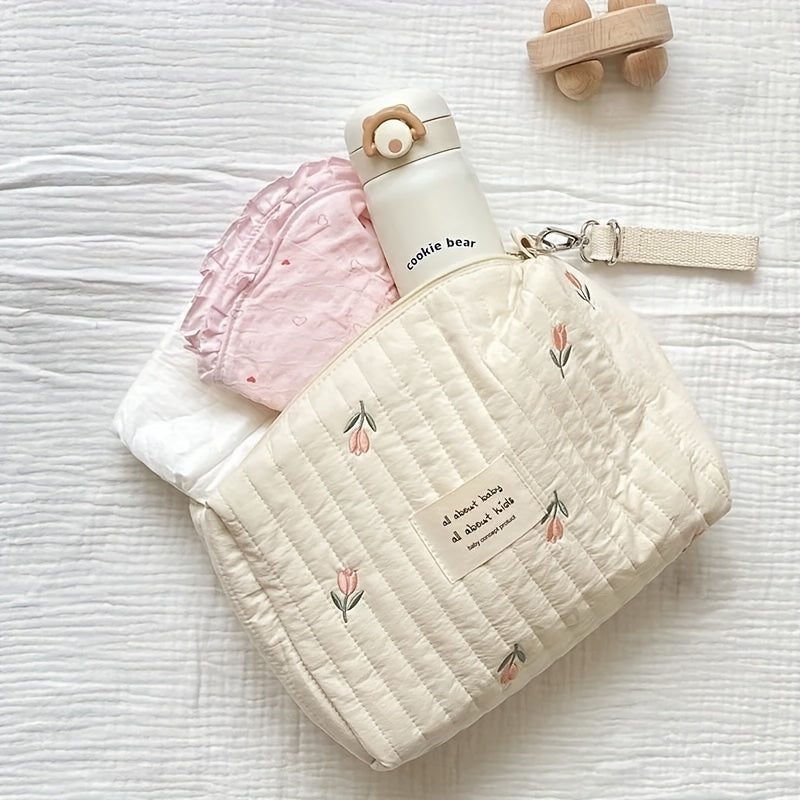 Stay organized on-the-go with this adorable Embroidered Diaper Clutch Bag designed for strollers. Made from durable polyester and featuring a quilted design, this pouch includes a secure zipper closure and cute floral embroidery. Perfect for ages 14 and