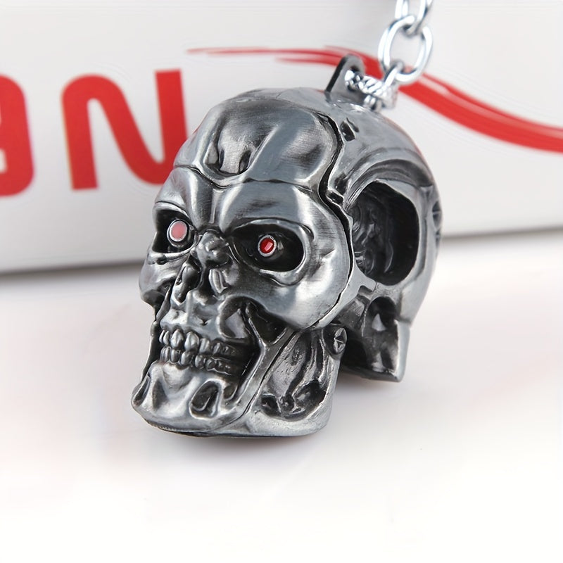 A stylish and versatile Terminator skull keychain that has a personality inspired by movies and TV shows. It is adorned with a golden pendant, adding an extra touch of flair.